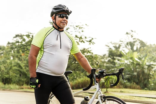 mature cyclist man with his bike photo