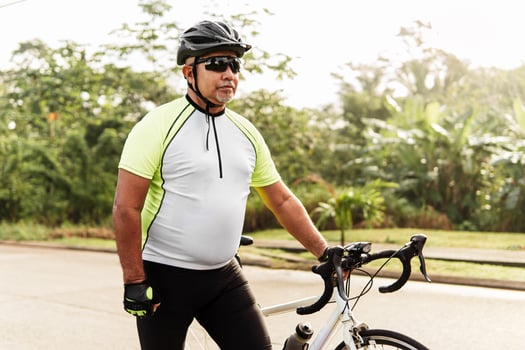 mature cyclist man with his bike photo