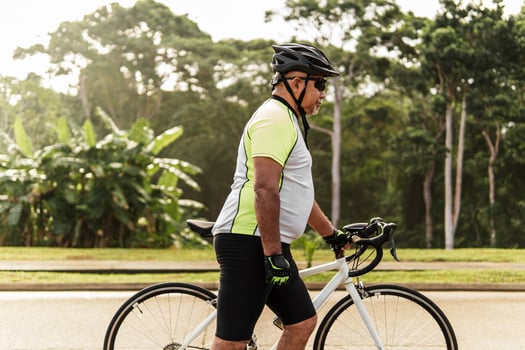 Side view of a cyclist man with his bike photo