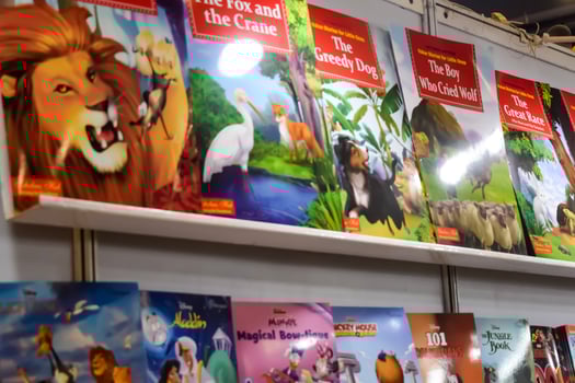 New Delhi, India, February 17 2024 - Variety of Books on shelf inside a book-stall at Delhi International Book Fair, Selection of books on display in Annual Book Fair at Bharat Mandapam complex photo