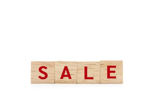 Red SALE word wooden blocks of business concept isolated on white background. Copy space and Clipping Path. Financial, Economic, Business, Marketing. photo