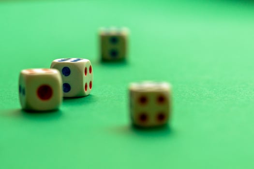 gaming dice on a rich green background. casino, betting and entertainment photo