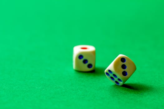gaming dice on a rich green background. casino, betting and entertainment photo
