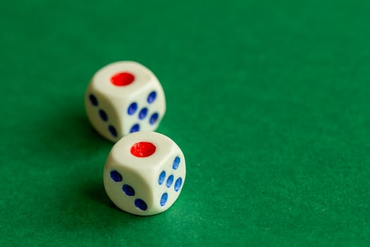 gaming dice on a rich green background. casino, betting and entertainment photo