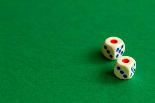 gaming dice on a rich green background. casino, betting and entertainment photo