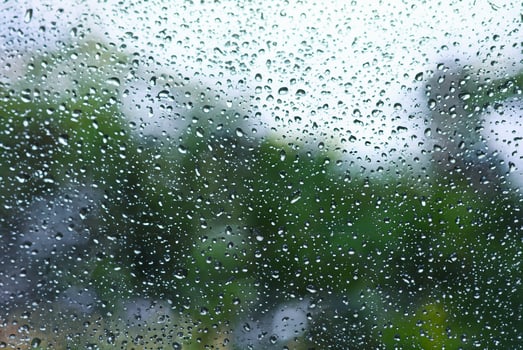 Macro Shot of Raindrop on Windowpane photo