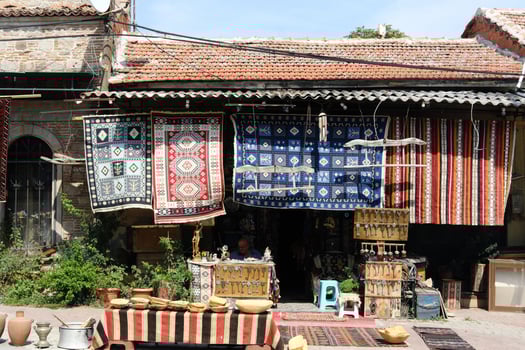 Vibrant Turkish Carpets Hanging at Outdoor Market photo