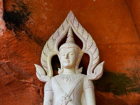 Buddha statues and sculptures at Phu Thok or Wat Chetiyakhiri ,Beautiful mountain landscape with rocky cliffs, Bueng Kan Province, Thailand. photo