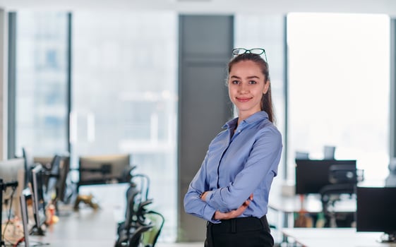 Confident Businesswoman. Blonde Executive Demonstrating Leadership with Crossed Arms. photo