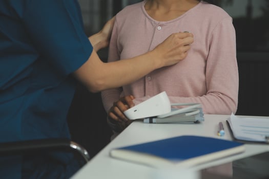 Doctor and patient discussing something while sitting at the table . Medicine and health care concept. Doctor and patient photo