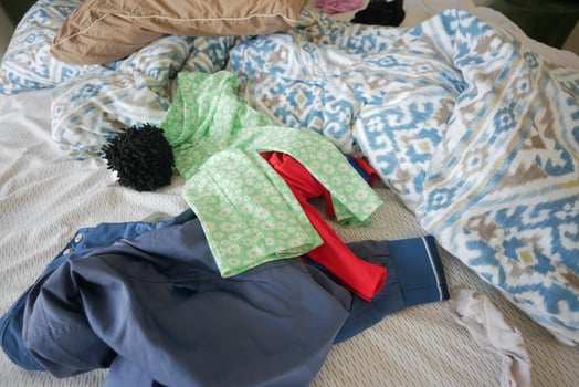 messy bed with cloths in early morning , messy bed after waking up photo