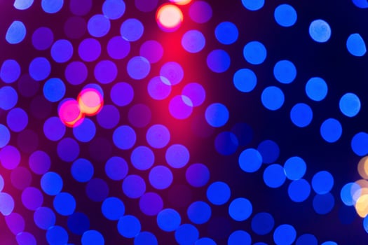 Beautiful blue and red bokeh lights glowing in the dark, festive illumination photo