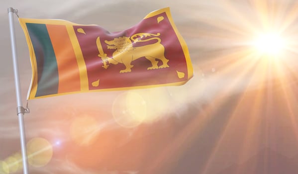 A Sri Lanka flag with the sun shining on it photo
