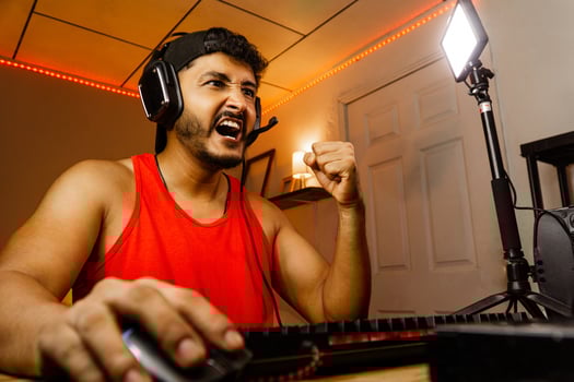 Adult Hispanic man celebrating a win playgame. photo