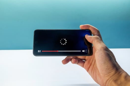 A man watching a movie via a smart phone. Streaming on internet concept. photo