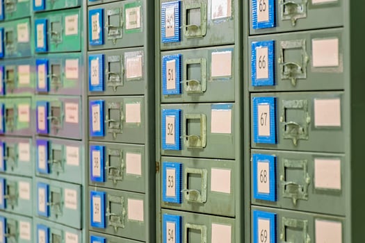 Filing cabinet is steel. Used for document storage. It is very active and long time to old. photo
