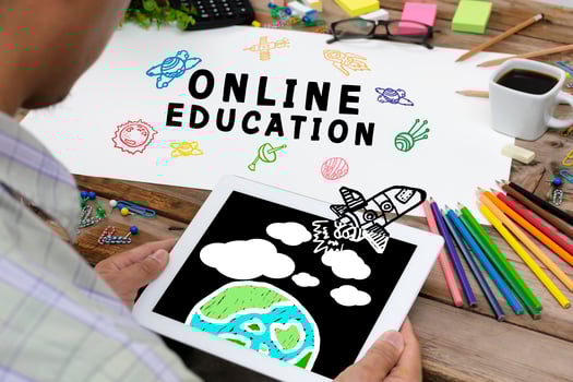Online Education Concept With Various Hand Drawn Doodle Icons On paper. photo