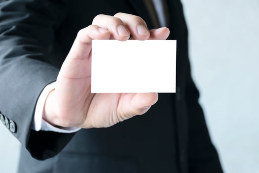 Copy space concept. Businessman holding a white business card. photo