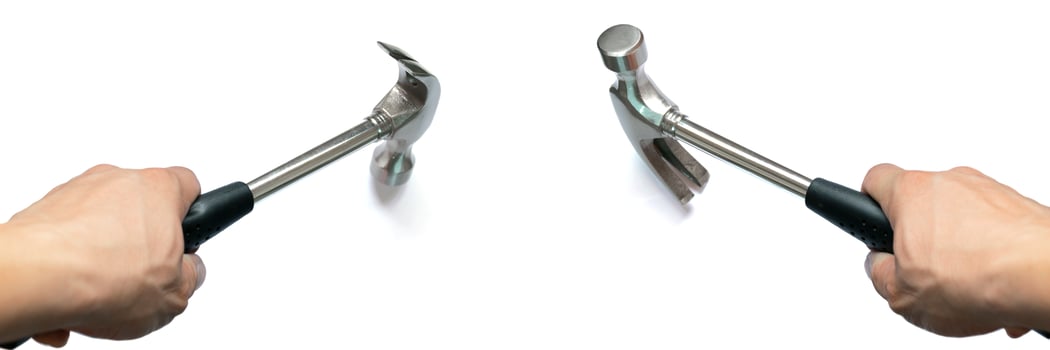 The hand holding the hammer is used with two characteristics. Hammering, leverage. photo