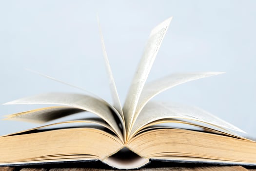 For educational success. Books that are open, paper looks moving. photo