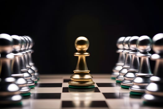 Golden pawn stands out on chessboard with silver pawns, dark background photo