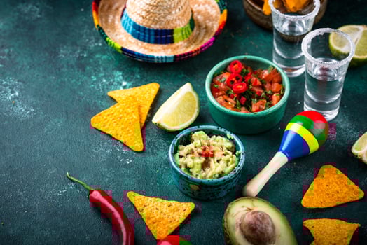 Traditional Mexican food nachos, salsa, guacamole, tequila. photo