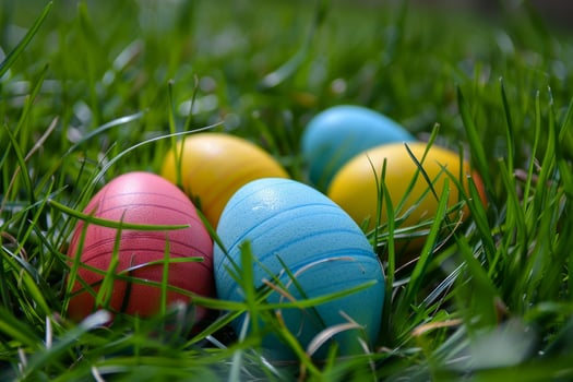 Colorful easter eggs hidden in fresh spring grass photo