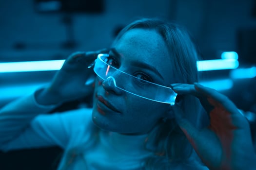 Portrait of a blonde in neon glasses. photo