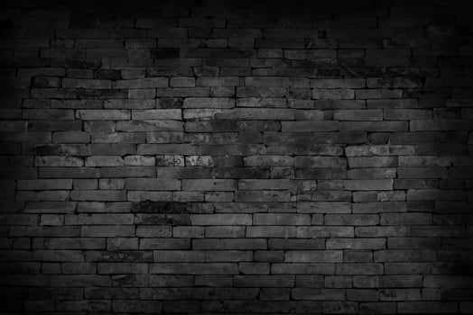 Textured Black Brick Wall Background in Unplastered Basement photo