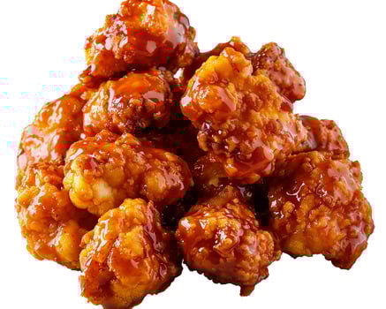 a pile of chicken nuggets on a white background photo