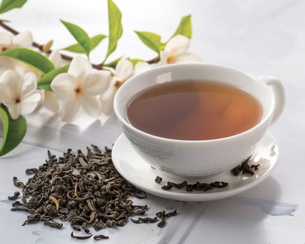black tea with jasmine flower photo