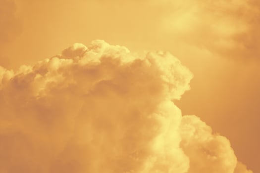 Orange fluffy clouds as background photo