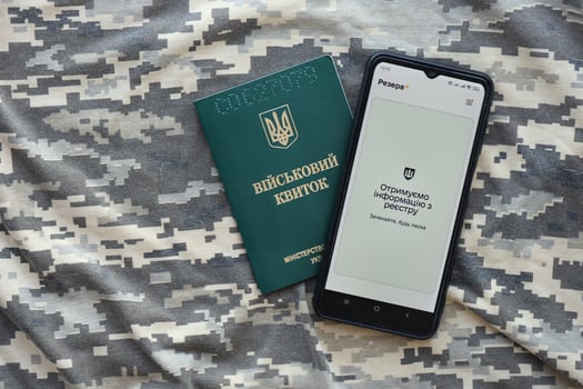 KYIV, UKRAINE - JUNE 20, 2024 Rezerv plus - ukrainian application for smartphone with actual personal information about conscript status for military recruits photo