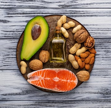 Healthy fat salmon, avocado, oil, nuts photo