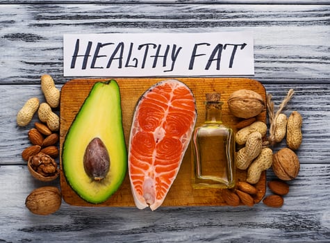 Healthy fat salmon, avocado, oil, nuts photo
