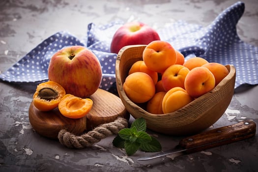 Sweet apricots on wooden background photo