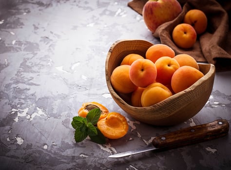 Sweet apricots on wooden background photo