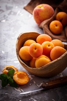 Sweet apricots on wooden background photo