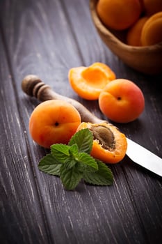 Sweet apricots on wooden background photo