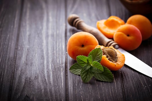 Sweet apricots on wooden background photo