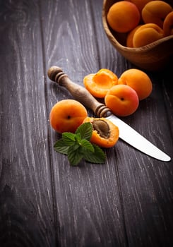 Sweet apricots on wooden background photo