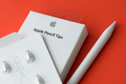 KYIV, UKRAINE - APRIL 20, 2024 Apple pencil tips for special apple pencil for drawing on iPad tablet on red background photo