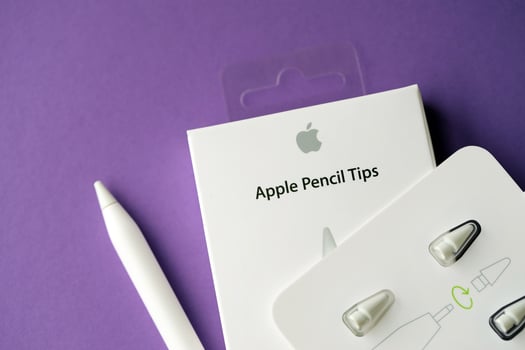 KYIV, UKRAINE - APRIL 20, 2024 Apple pencil tips for special apple pencil for drawing on iPad tablet on violet background photo
