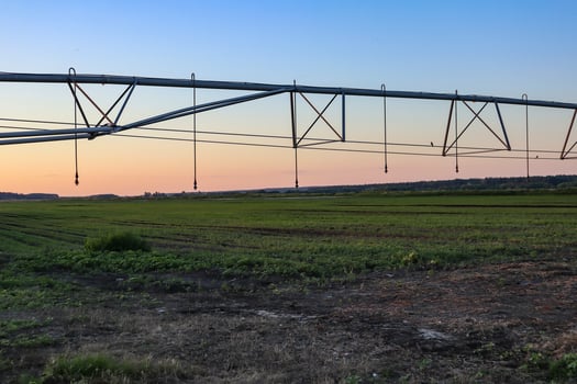 Field with mobile Irrigation system for water supply. Automatic field watering system. photo