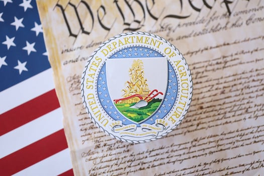 KYIV, UKRAINE - MARCH 9, 2024 US Department of Agriculture seal with United States Constitution on flag photo