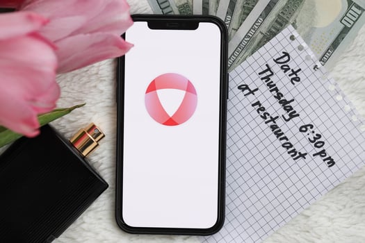 KYIV, UKRAINE - FEBRUARY 23, 2024 Open logo of famous dating website or app on iPhone display photo