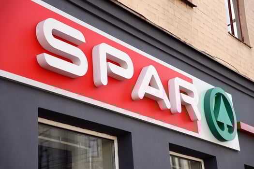 KHARKIV, UKRAINE - AUGUST 29, 2021 Spar logo on a wall. Spar is an international group of independently owned and operated retailers and wholesalers who work together photo