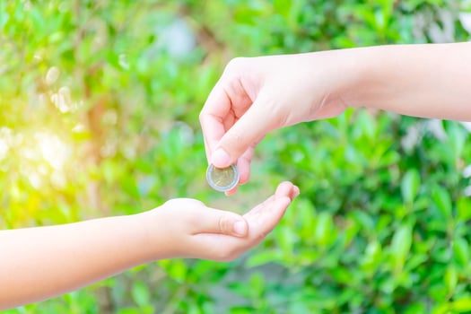 Mother giving coin photo