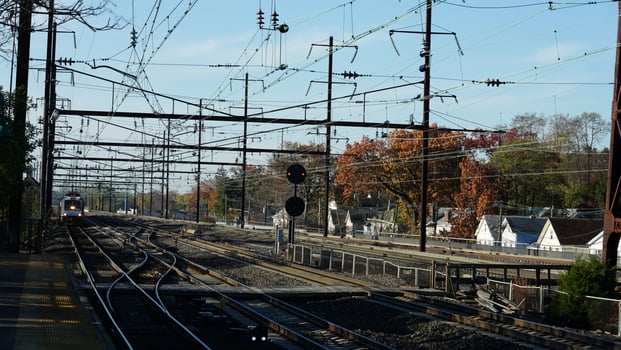 The train station view with the iron tracks near the platform photo