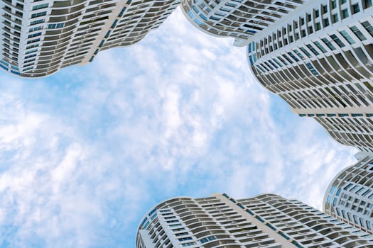 Panoramic and perspective wide angle view to steel blue background of high rise building skyscrapers photo